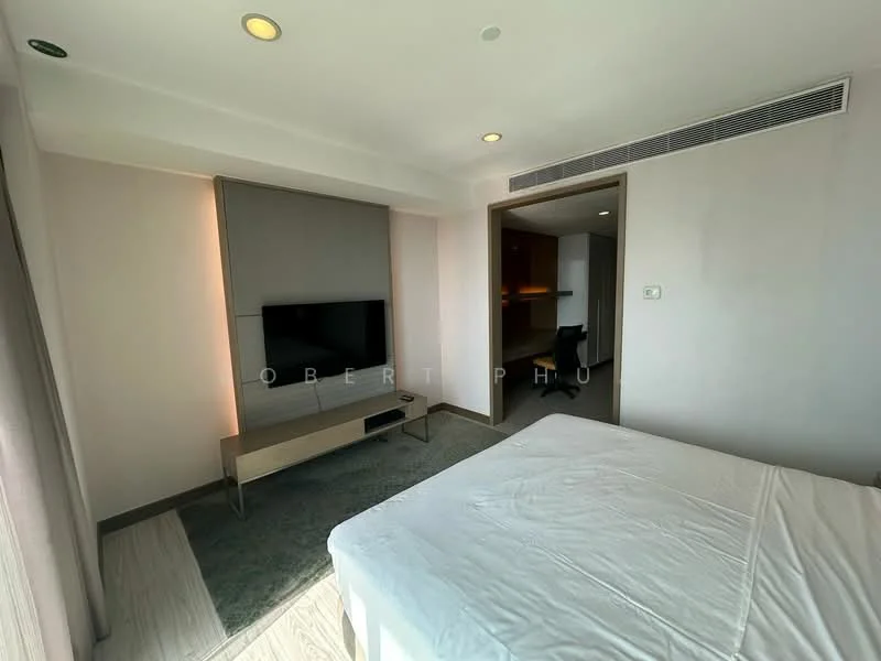 Bedroom features: queen-size bed, wall-mounted TV, wooden TV console, grey carpet flooring, recessed downlights, sheer curtains, built-in wardrobe, neutral painted walls; style: modern.