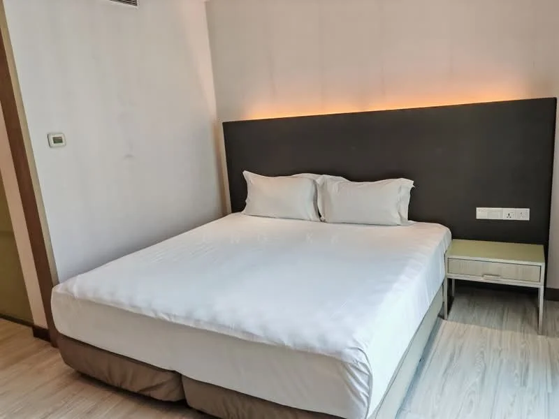 Bedroom features: king-size bed, upholstered headboard, bedside table, white bedding, wooden flooring, wall-mounted light fixture, neutral wall color, minimalist decor; style: modern.