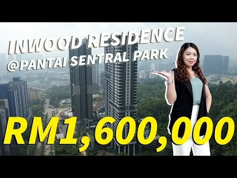 Exterior type: high-rise condominium; features: glass curtain wall, recessed balconies, surrounded by greenery, urban skyline in background; style: modern.
