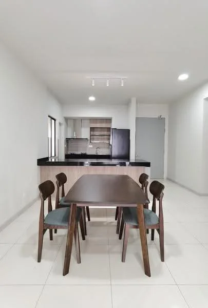Dining features: 4-seater dining table in dark wood, wooden dining chairs with blue upholstery, white painted walls, tile flooring, recessed LED downlights, open layout to kitchen, black granite countertop, stainless-steel fridge visible in kitchen area, kitchen cabinetry in light wood; style: modern.