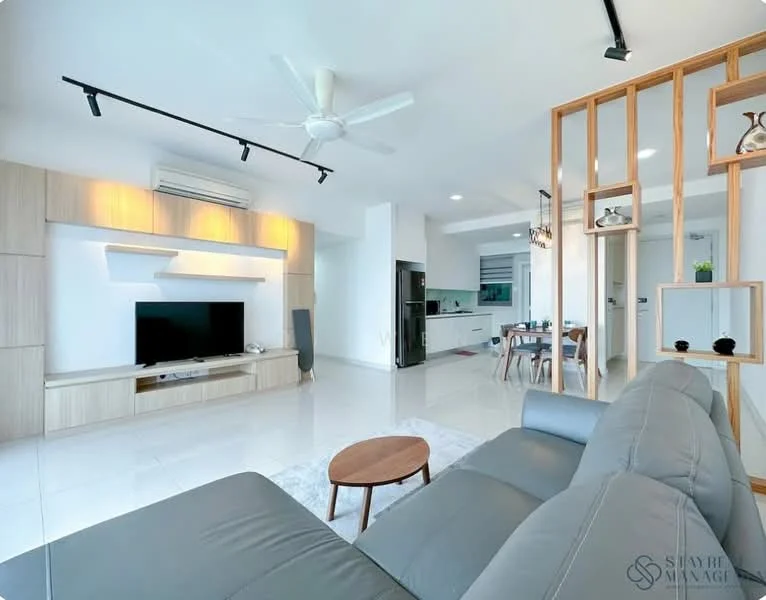 Living features: 3-seater fabric sofa in grey, round coffee table, wall-mounted TV, built-in TV console with light wood finish, white painted walls, white tiled flooring, ceiling fan with light, recessed downlights, open layout to kitchen, large windows for natural light; style: modern. Kitchen features: kitchen island, stainless-steel fridge, built-in oven, ceramic cooktop, white cabinetry, black countertop, pendant lighting above island, open shelving; style: modern.