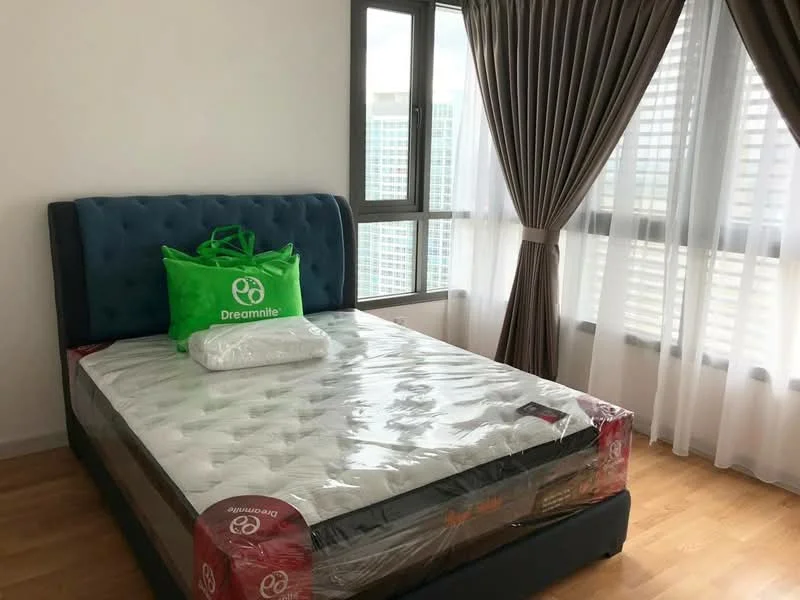 Bedroom features: queen-size bed with upholstered headboard, mattress with protective cover, two decorative pillows, green tote bag on bed, floor-to-ceiling windows, sheer curtains, blackout curtains, wooden flooring, neutral painted walls; style: modern; view: city.