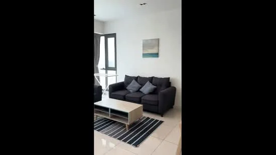 Living features: 3-seater fabric sofa in dark grey, coffee table with light wood finish, area rug with striped pattern, floor-to-ceiling windows, white painted walls, tile flooring, framed artwork on wall, curtains, decorative cushions; style: modern; view: city.