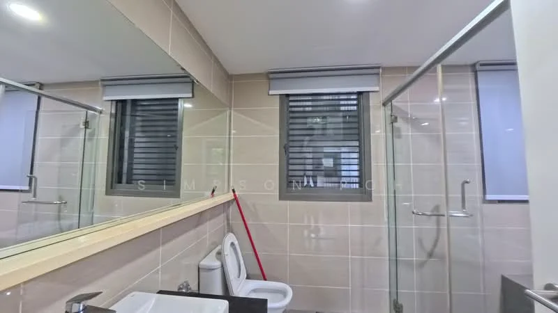 Bathroom features: single-sink vanity with dark countertop, framed mirror above vanity, white ceramic toilet, walk-in shower with glass enclosure, chrome shower head, tile cladding on walls, grey tile flooring, window with horizontal blinds, towel rack, cleaning supplies visible; style: modern.