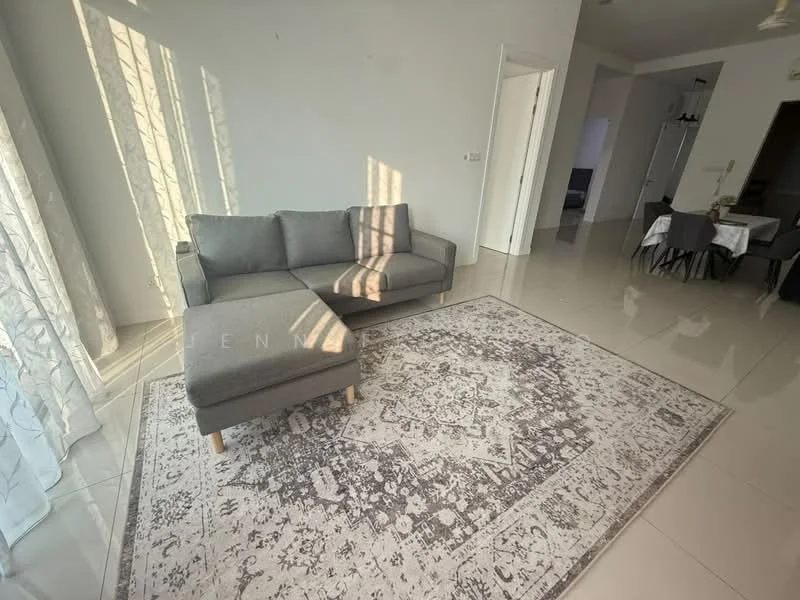 Living features: grey fabric L-shape sectional sofa, area rug with intricate pattern, white painted walls, large windows with sheer curtains, glossy tile flooring, natural light streaming in, dining area visible in background, open layout; style: modern.