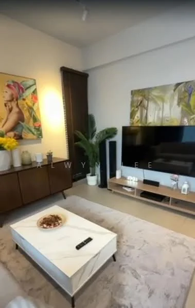 Living features: framed artwork with colorful design, cream painted walls, light-colored carpet flooring, 3-seater fabric sofa in beige, coffee table with marble top, TV console with wall-mounted TV, decorative plant in corner, decorative bowl on coffee table, wall-mounted artwork with nature theme, LED wall sconce lighting; style: modern.