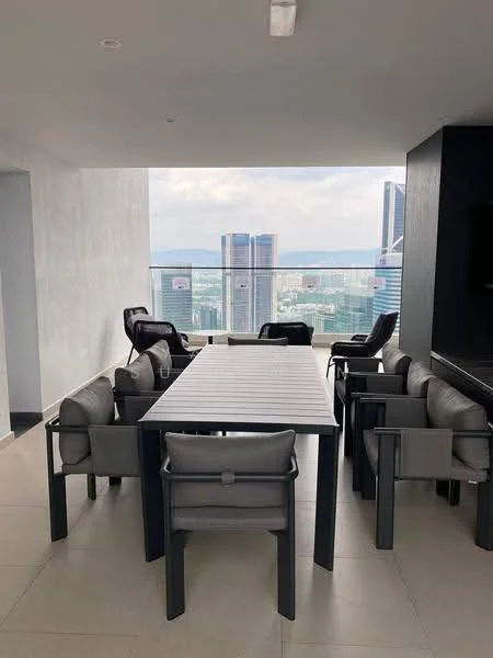 Dining features: large rectangular dining table, 8 dining chairs with armrests, grey upholstery on chairs, glass railing, city skyline view, neutral tiled flooring, recessed ceiling lights, wall-mounted TV, minimalist decor; style: modern; view: city.