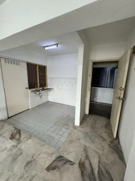 Room features: grey tiled flooring, white painted walls, exposed brick wall, single-bowl stainless-steel sink, wall-mounted faucet, fluorescent ceiling light, doorway leading to another room, door with handle, window with no visible treatment; style: minimalist.