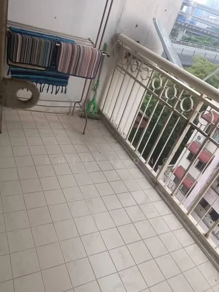 Balcony features: tiled flooring, metal railing, clothes drying rack, green cleaning tool, partial view of surrounding greenery, overhead cover, open space; view: garden.