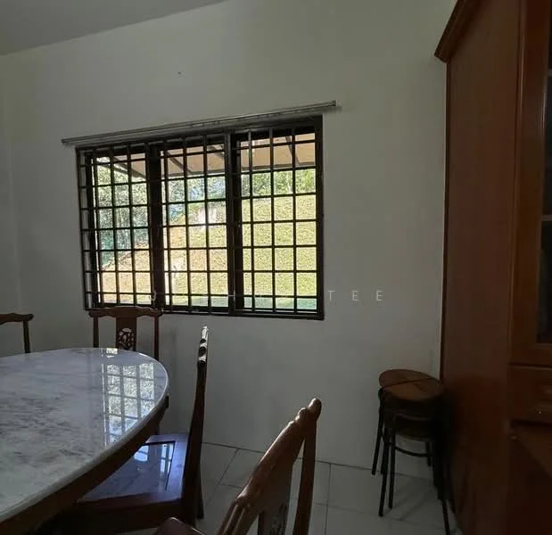 Dining features: round dining table with marble top, wooden dining chairs, window with security grille, white painted walls, ceramic tile flooring, wooden cabinet, small wooden stools; view: garden.