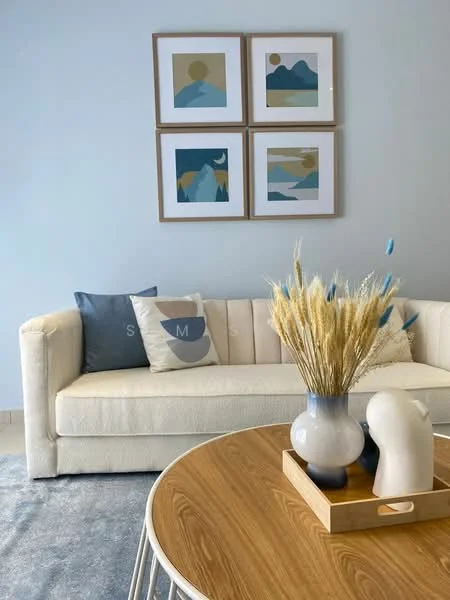 Living features: white fabric sofa, decorative throw pillows, round wooden coffee table, vase with dried flowers, framed artwork on walls, light blue painted walls, area rug, decorative ceramic object; style: modern.