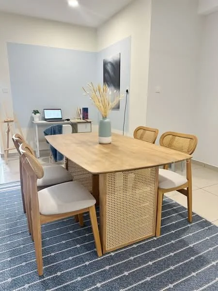 Dining features: wooden dining table, 4 dining chairs with cane backrest, light grey upholstered seat cushions, decorative vase with dried flowers, striped area rug, neutral wall colour, laptop on desk in background, wall-mounted electrical outlet; style: modern.