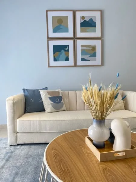 Living features: white fabric sofa, decorative cushions in blue and cream, round wooden coffee table, vase with dried flowers, artwork on walls, light blue painted walls, area rug, wooden tray on coffee table; style: modern.