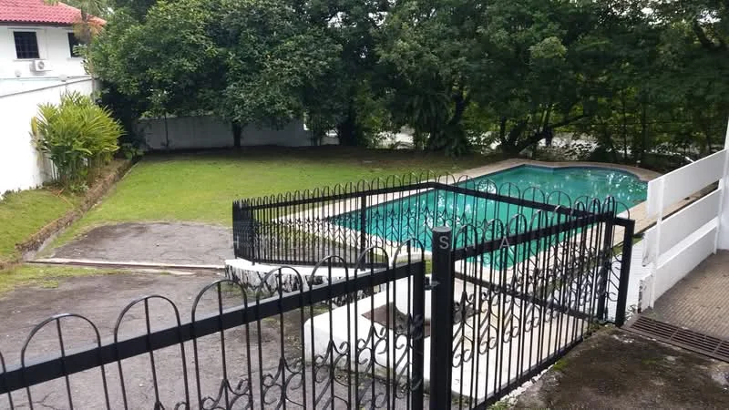 Exterior type: detached bungalow; features: swimming pool, manicured lawn, fenced perimeter, concrete pool deck, landscaped garden, gated entry, surrounded by greenery; style: modern.
