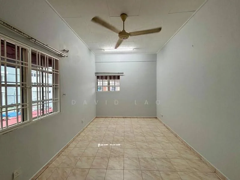 Room features: light beige tiled flooring, white painted walls, ceiling fan, two small windows with grilles, no visible furniture, plain ceiling, neutral color scheme; style: minimalist.