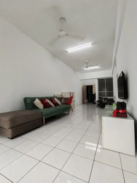 Living features: white painted walls, glossy white tile flooring, 5-blade ceiling fan, sofa in green fabric, 2-seater brown fabric sofa, decorative cushions in various colors, TV mounted on wall, white coffee table, white side table, open layout, natural light from windows, neutral decor; style: modern.