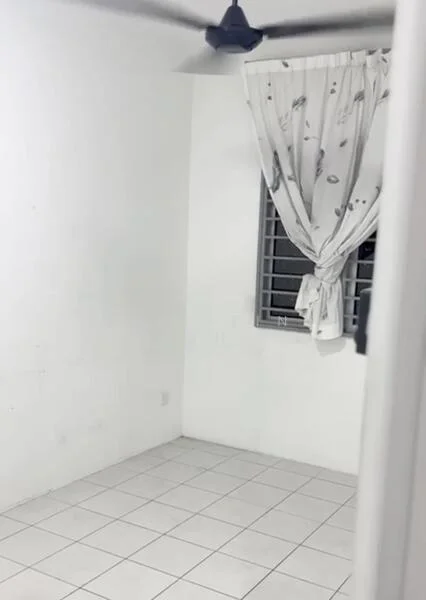 Room features: white painted walls, white tiled flooring, ceiling fan, window with grille, curtains with floral pattern.