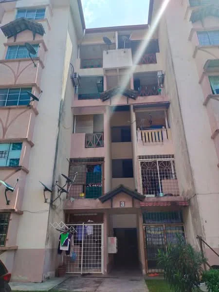 Exterior type: low-rise apartment block; features: pink painted facade, balconies with railings, multiple windows, external air conditioning units, laundry hanging area, ground floor access, entrance with numbered door, surrounding greenery; style: modern.