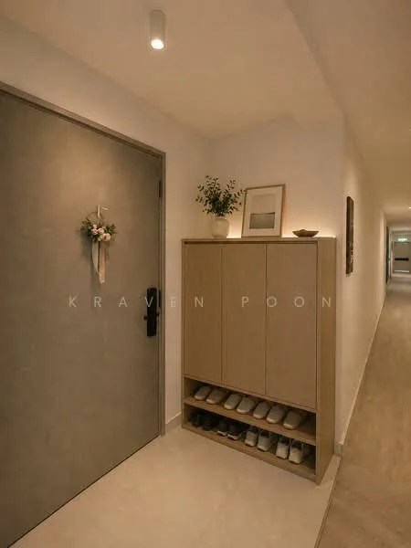 Room features: grey door, wooden shoe cabinet, white walls, recessed ceiling light, light wood flooring, decorative wall art, potted plant on cabinet, hallway leading to other rooms; style: modern.