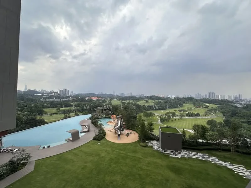 Exterior type: swimming pool deck; features: infinity pool, pool deck with loungers, children's playground, water slide, landscaped garden, manicured lawn, city skyline in background, surrounded by greenery; style: modern.