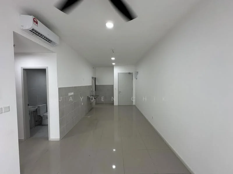 Room features: white painted walls, grey tiled flooring, recessed downlights, 1 wall-mounted split AC, open layout, doorway leading to bathroom, doorway leading to kitchen area, no visible furniture or decor; style: modern.