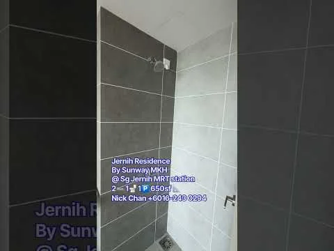 Bathroom features: walk-in shower with glass enclosure, chrome handheld shower head, grey tile cladding on walls, white tile cladding on walls, grey floor tiles, drainage channel on floor, modern faucet, minimalist design; style: modern.