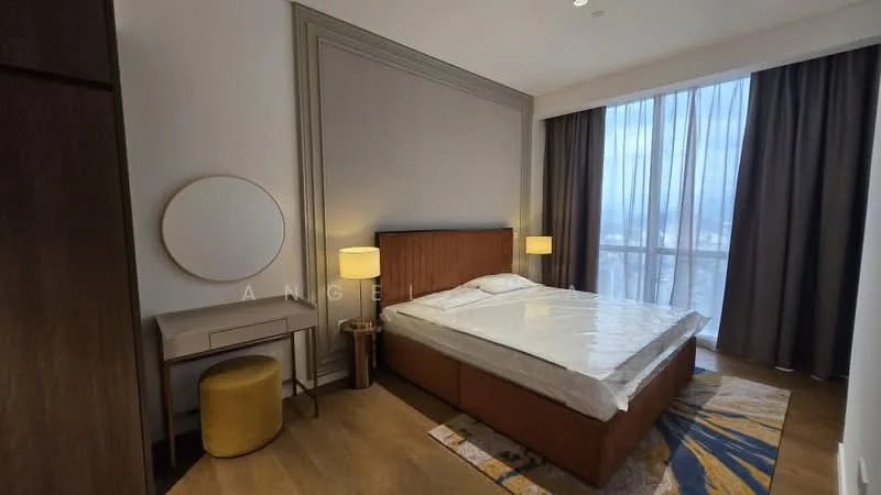 Bedroom features: king-size bed, upholstered headboard, two bedside lamps, wooden bedside tables, dressing table with round mirror, yellow ottoman, floor-to-ceiling windows, curtains, wooden flooring, decorative area rug with pattern, wall paneling, neutral wall color; style: modern; view: city.