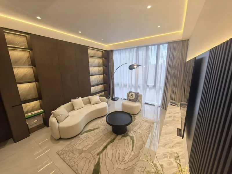 Living features: curved white fabric sofa, black round coffee table, recessed LED lighting, floor-to-ceiling windows with sheer curtains, light wood paneling, marble flooring, decorative area rug with leaf pattern, modern floor lamp, built-in shelving with backlighting, wall-mounted TV; style: modern.