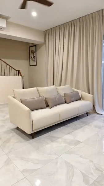 Living features: 3-seater fabric sofa in cream, decorative cushions, marble tile flooring, light beige walls, floor-to-ceiling curtains in light fabric, ceiling fan, staircase in background, wall art, natural light from window; style: modern.