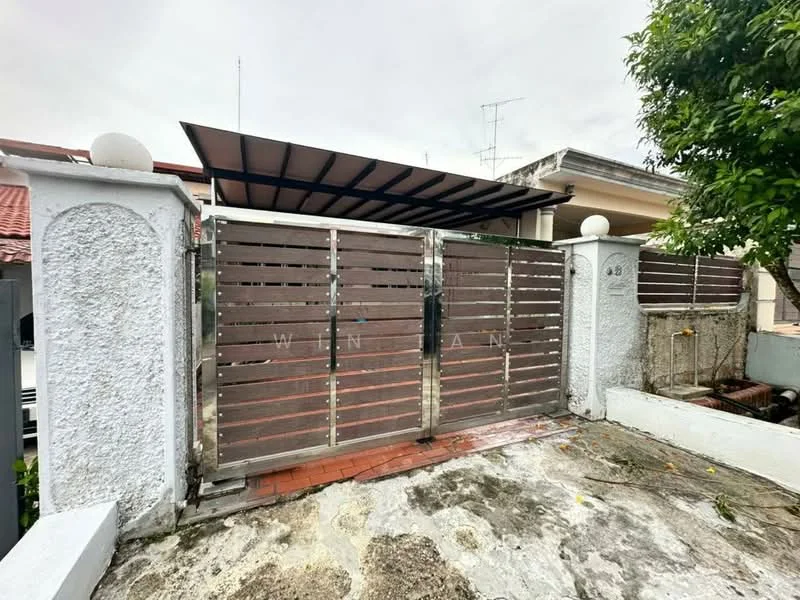 Exterior features: metal gate with wooden slats, white painted wall, paved driveway, car porch with awning, surrounding greenery, brick pathway; style: modern.