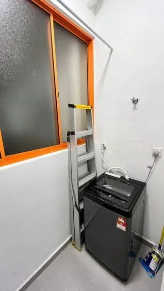 Laundry features: top-load washing machine in grey, ladder, window with orange frame, white painted walls, grey tile flooring.
