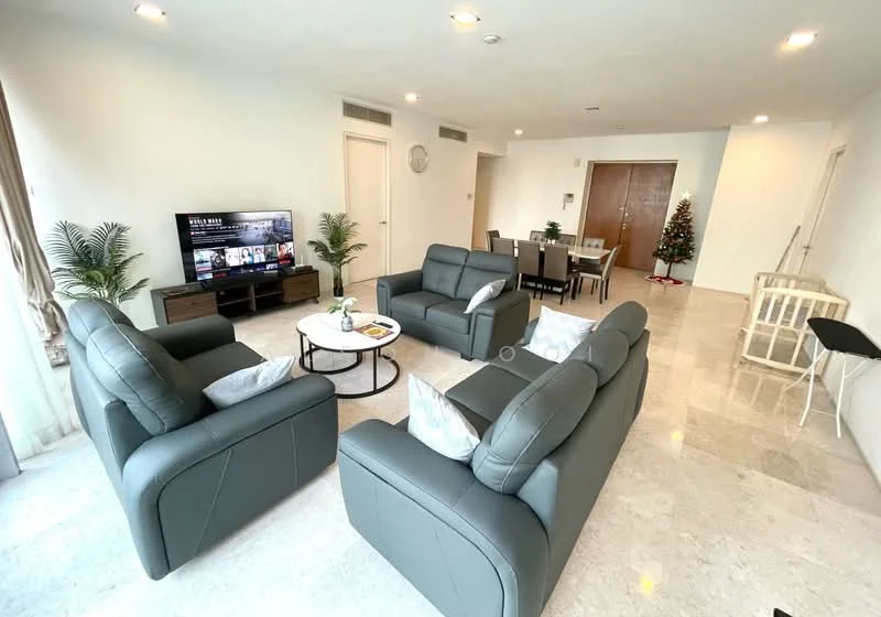 Living features: grey leather 3-seater sofa, 2 grey leather armchairs, round coffee table with black top, flat-screen TV on console, decorative plants in pots, marble flooring, recessed ceiling lights, large windows with sheer curtains, dining table with 6 chairs, Christmas tree in corner, wooden console table, baby crib, folding chair; style: modern.