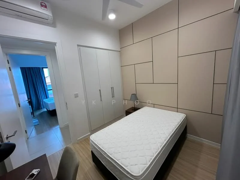 Bedroom features: queen-size bed base, mattress on bed base, light wood flooring, cream painted walls with geometric paneling, built-in wardrobe with sliding doors, desk with chair, table lamp, ceiling fan, window with blue curtains; style: modern.