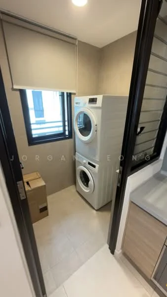 Laundry features: stacked front-load washing machine, stacked dryer, white appliances, grey tiled walls, light-colored tile flooring, window with black frame, roller blinds, box for storage; style: modern.