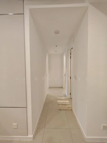 Hallway features: white painted walls, tile flooring, recessed ceiling lights, doorway to adjacent rooms, neutral color scheme, straight corridor layout; style: modern.