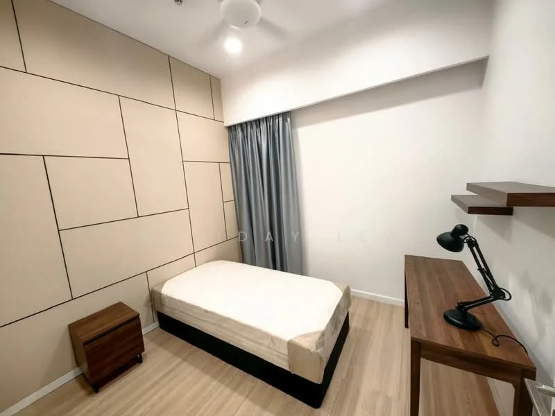 Bedroom features: single bed, light wood flooring, cream upholstered bed frame, geometric patterned accent wall, white painted walls, floor-to-ceiling window with grey curtains, wooden bedside table, desk with lamp; style: modern.
