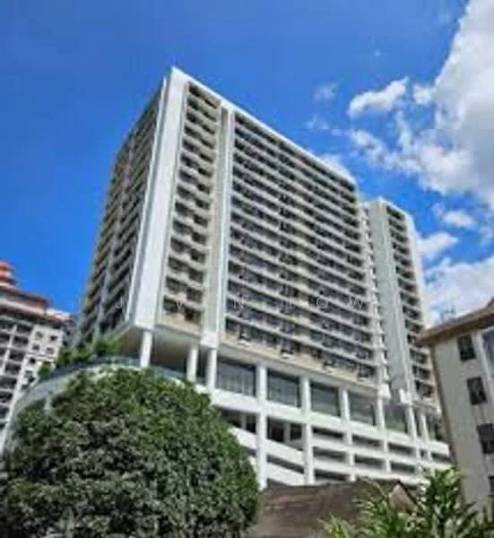 Exterior type: high-rise condominium; features: glass curtain wall, white painted facade, recessed balconies, approximately 15-storey high-rise, manicured landscaping, surrounded by mature greenery; style: modern.