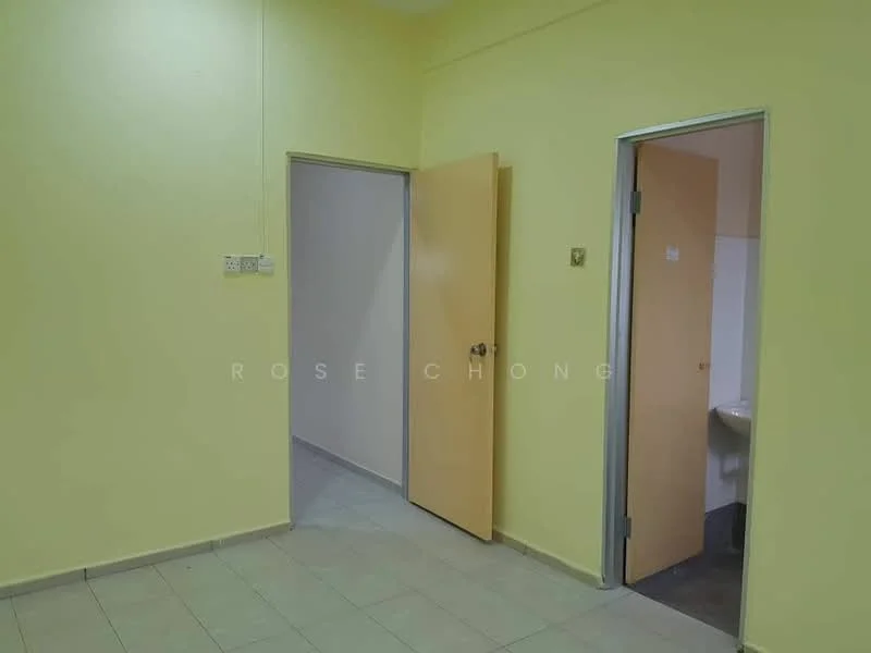 Room features: yellow painted walls, light grey tiled flooring, two doors, one door leading to a bathroom, one door leading to another room, no visible windows, ceiling light fixture.