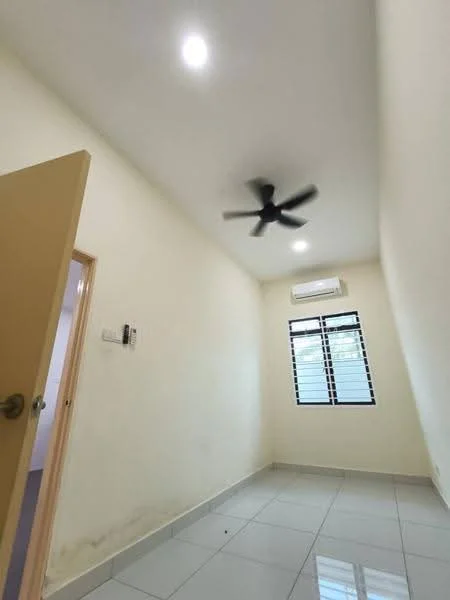 Room features: white painted walls, glossy ceramic tile flooring, ceiling fan, wall-mounted split AC, single window with black grilles, door to hallway.