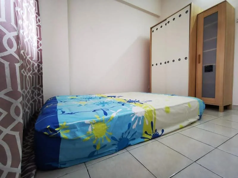 Bedroom features: single bed with colorful bedding, built-in wardrobe with sliding doors, wooden cabinet, tiled flooring, curtains with geometric pattern, neutral wall color, natural light from window.
