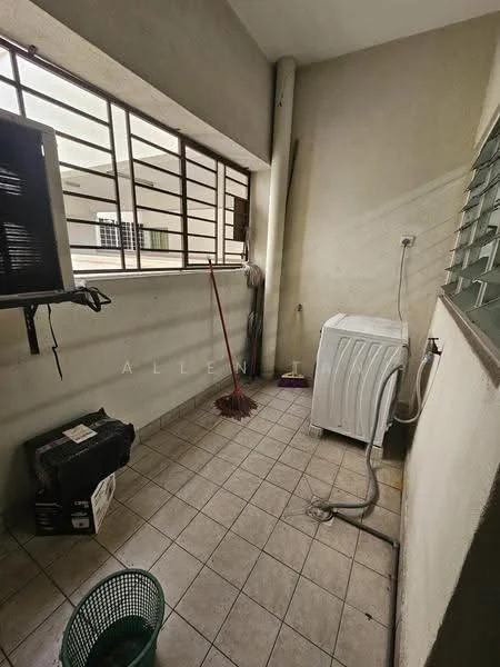 Laundry features: tiled flooring, washing machine, window with metal grille, broom, plastic laundry basket, drainage pipe, wall-mounted faucet, exposed plumbing, neutral wall color.