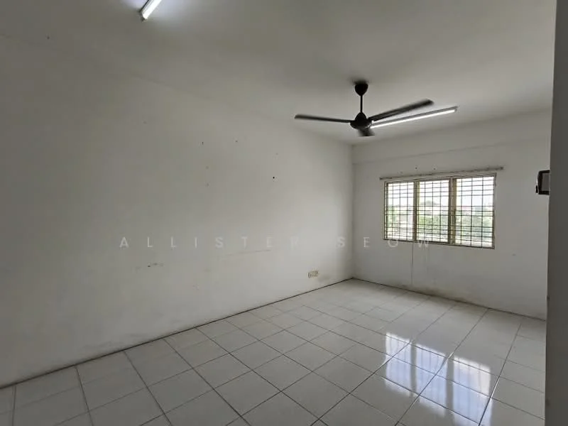Room features: white painted walls, white tiled flooring, ceiling fan, two windows with metal grills, natural light from windows.