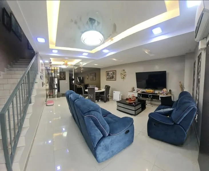 Living features: blue fabric L-shape sectional sofa, coffee table, wall-mounted TV, entertainment unit, recessed ceiling lights, ceiling fan, white tiled flooring, grey painted walls, decorative wall art, open layout to dining area; style: modern. Dining features: dining table with chairs, white cabinetry, decorative items on table; style: modern.