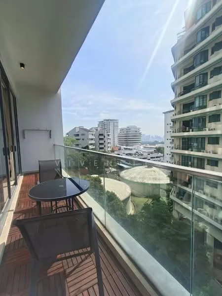 Balcony features: glass railing, wooden decking, outdoor dining table, two chairs, city skyline view, overhead lighting; style: modern; view: city.