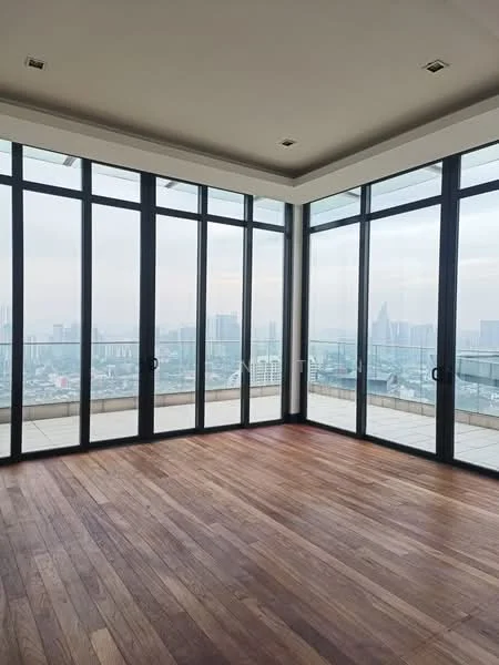 Room features: floor-to-ceiling windows, wooden flooring, city view, high ceiling, neutral wall color, recessed lighting, open layout, corner room; style: modern; view: city.