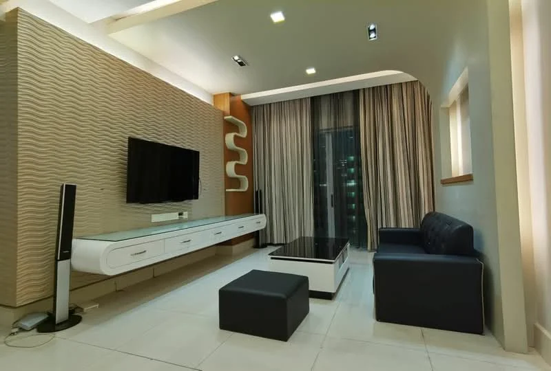 Living features: textured feature wall with wavy design, wall-mounted flat-screen TV, white media console with drawers, black leather sofa, black coffee table with glass top, black ottoman, floor-to-ceiling windows with sheer curtains, recessed downlights, light-colored tiled flooring, decorative wall shelving, curtains in neutral tones; style: modern; view: city.