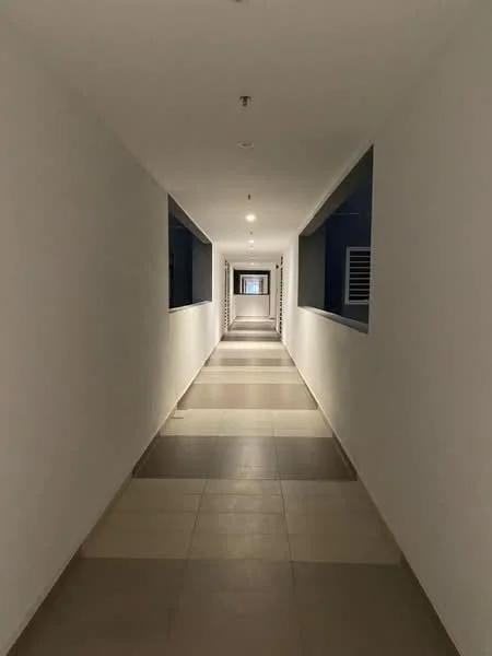 Hallway features: white painted walls, tile flooring in beige and grey, recessed ceiling lights, windows on both sides, straight corridor layout; style: modern.