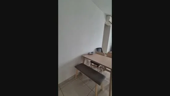 Room features: white painted walls, tile flooring, dining table, bench seating, wall-mounted air conditioning unit.