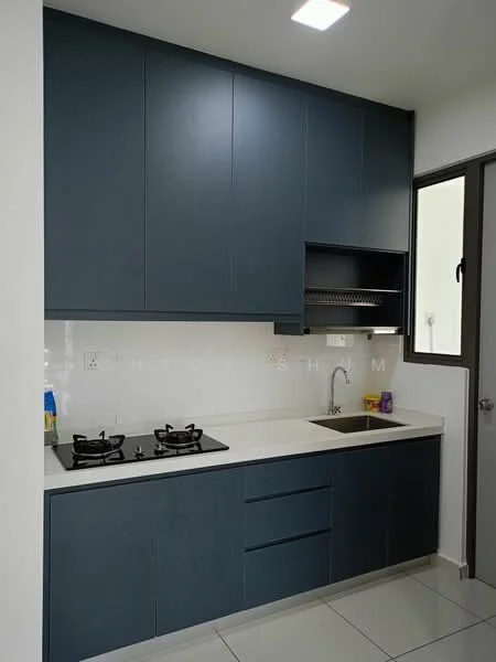 Kitchen features: blue cabinetry, white countertop, stainless-steel sink, chrome faucet, gas cooktop with two burners, wall-mounted storage shelf, white tiled backsplash, grey floor tiles, recessed ceiling lights, window for natural light; style: modern.