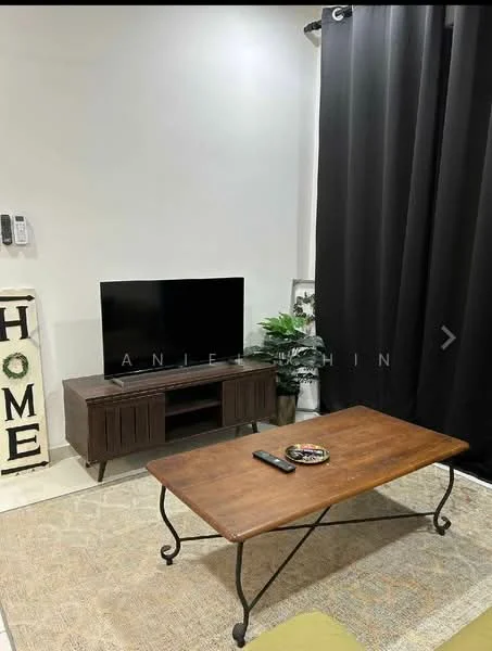Living features: black curtains, wooden coffee table, TV console in dark wood, flat-screen TV, decorative plant, area rug with neutral tones, wall-mounted intercom, decorative sign with the word 'HOME'; style: modern.